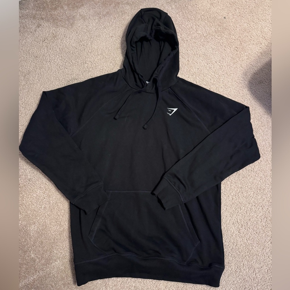 Brand new Gymshark Crest hoodie size Large in color black.very soft:)